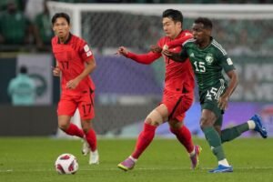 South Korea's Son Heung-Min, center, duels for the ball with Saudi Arabia's Abdullah Al Khaibar